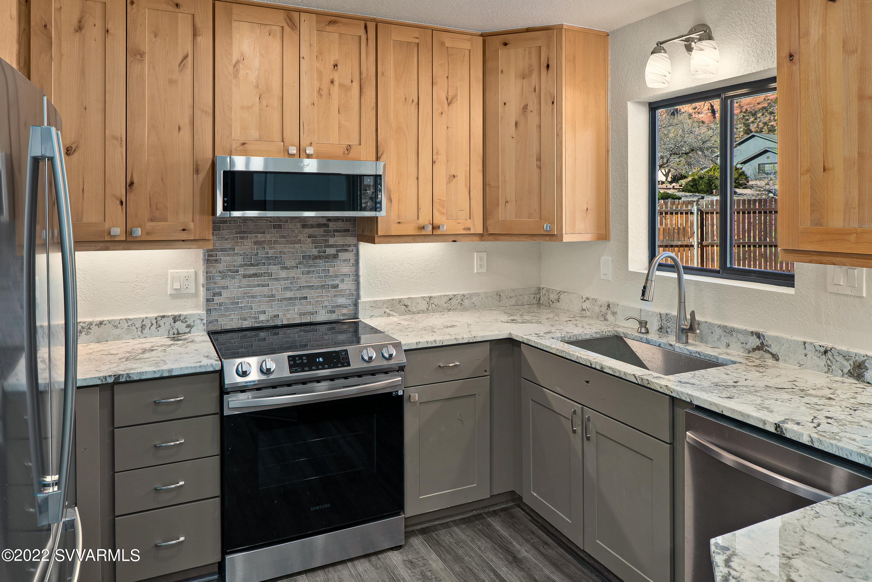 2380 Buckboard Road Sedona, AZ 86336 - Photo 8 of 25 a kitchen with granite countertop a sink and cabinets
