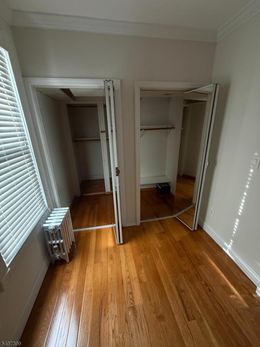 28 Reid Street, Unit 2 Elizabeth, NJ 07201 - Photo 14 of 19 a view of wooden floor in an empty room