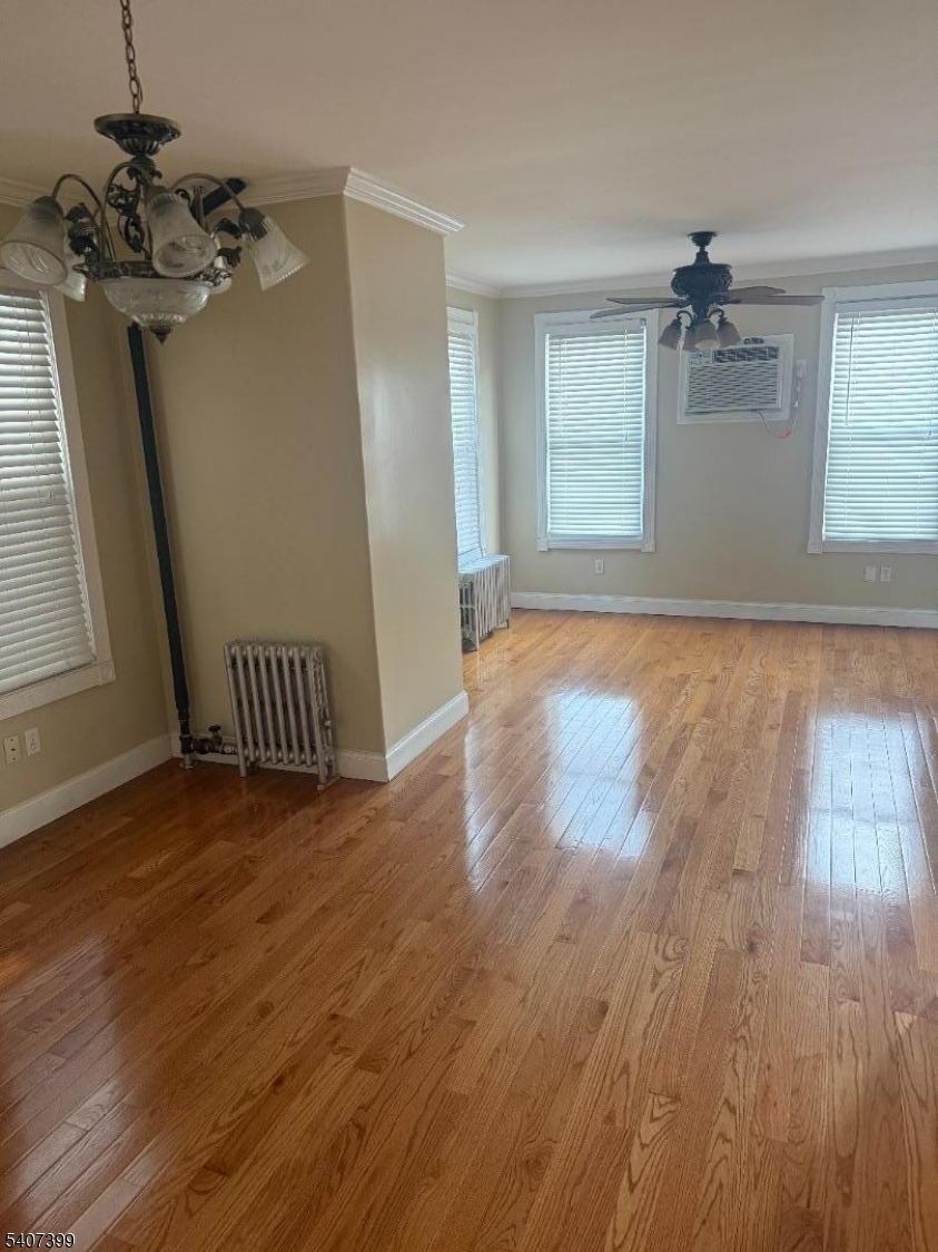 28 Reid Street, Unit 2 Elizabeth, NJ 07201 - Photo 5 of 19 wooden floor in an empty room with a window