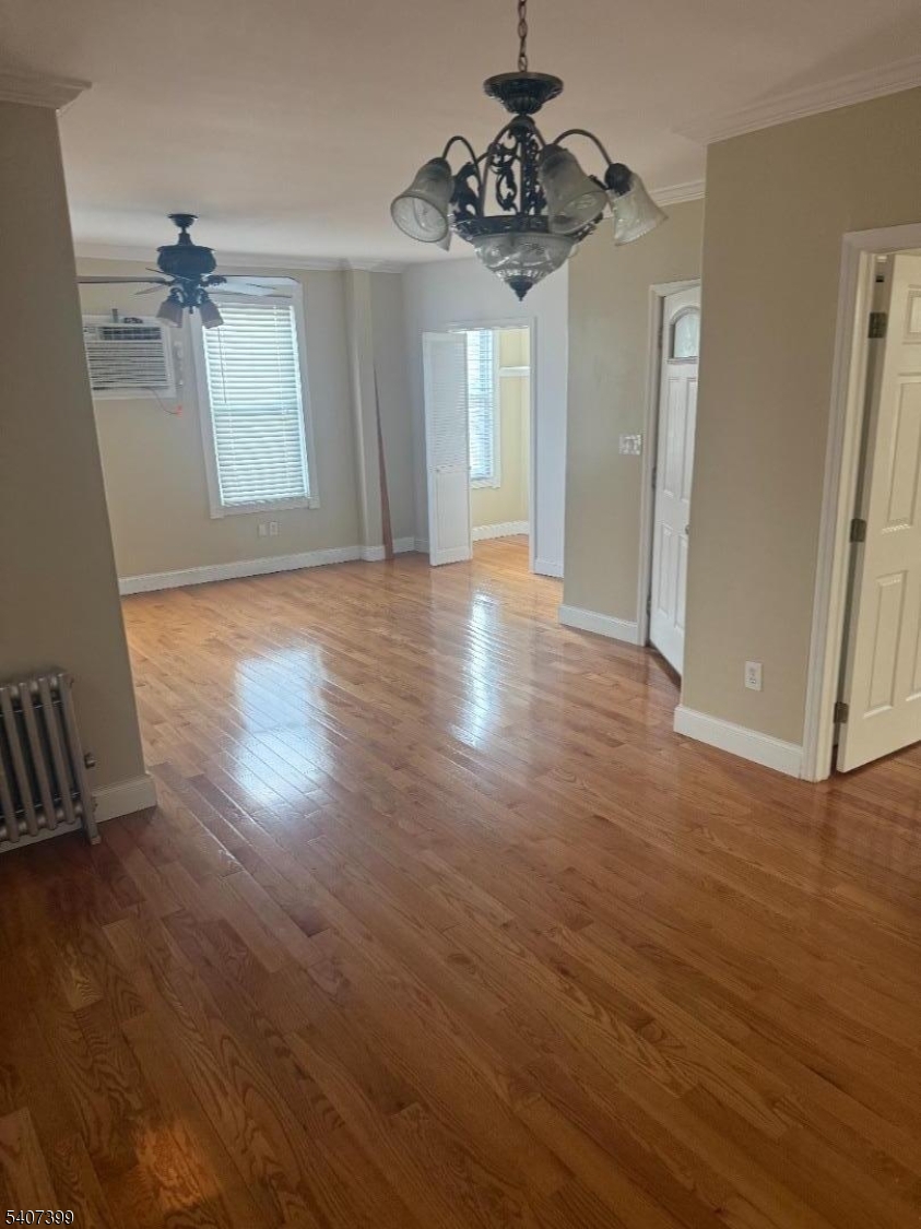 28 Reid Street, Unit 2 Elizabeth, NJ 07201 - Photo 6 of 19 a view of an empty room with wooden floor and a window