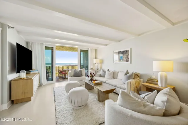 a living room with furniture or couch and a flat screen tv