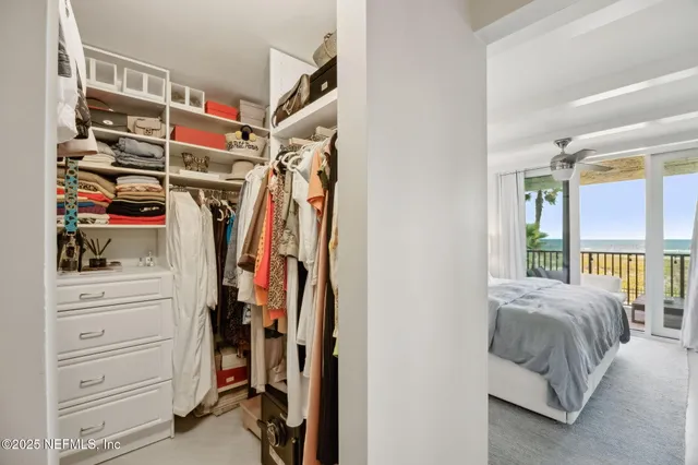 a bedroom with a large bed and a flat screen tv