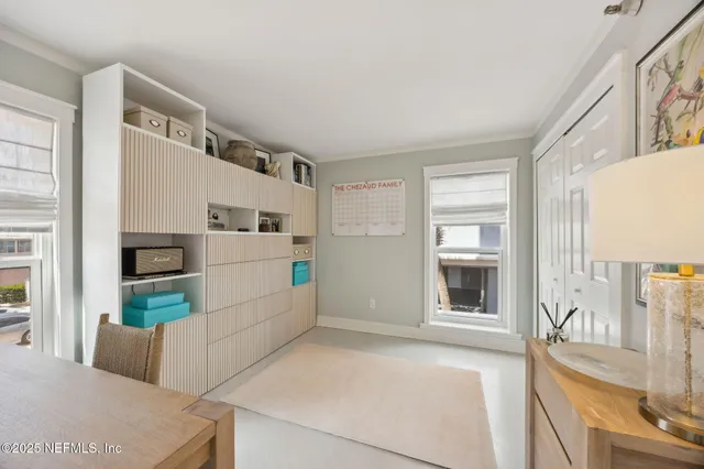 a view of kitchen with furniture and refrigerator