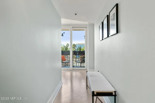 a roof deck with couches and sky view