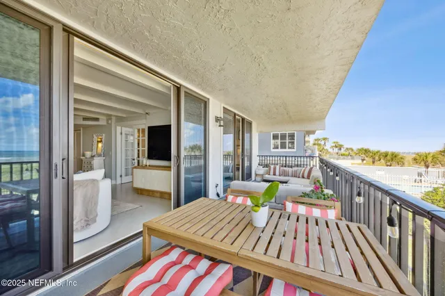 a balcony with furniture and city view