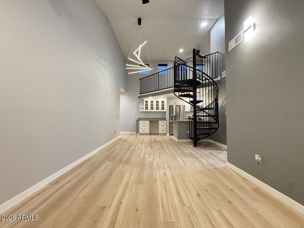 1701 East Colter Street, Unit 431 Phoenix, AZ 85016 - Photo 11 of 23 a view of empty room with wooden floor