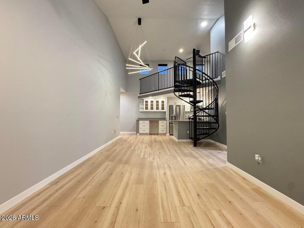 1701 East Colter Street, Unit 431 Phoenix, AZ 85016 - Photo 11 of 23 a view of empty room with wooden floor