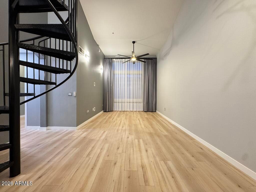 1701 East Colter Street, Unit 431 Phoenix, AZ 85016 - Photo 12 of 23 a view of empty room with wooden floor