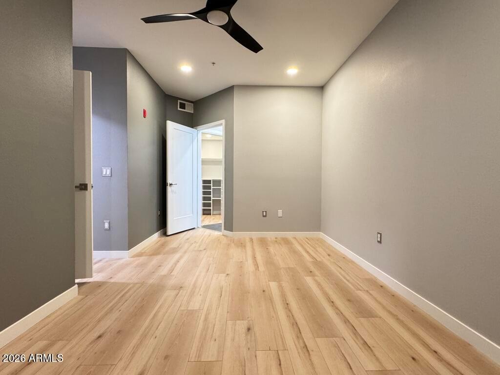 1701 East Colter Street, Unit 431 Phoenix, AZ 85016 - Photo 15 of 23 a view of empty room with wooden floor
