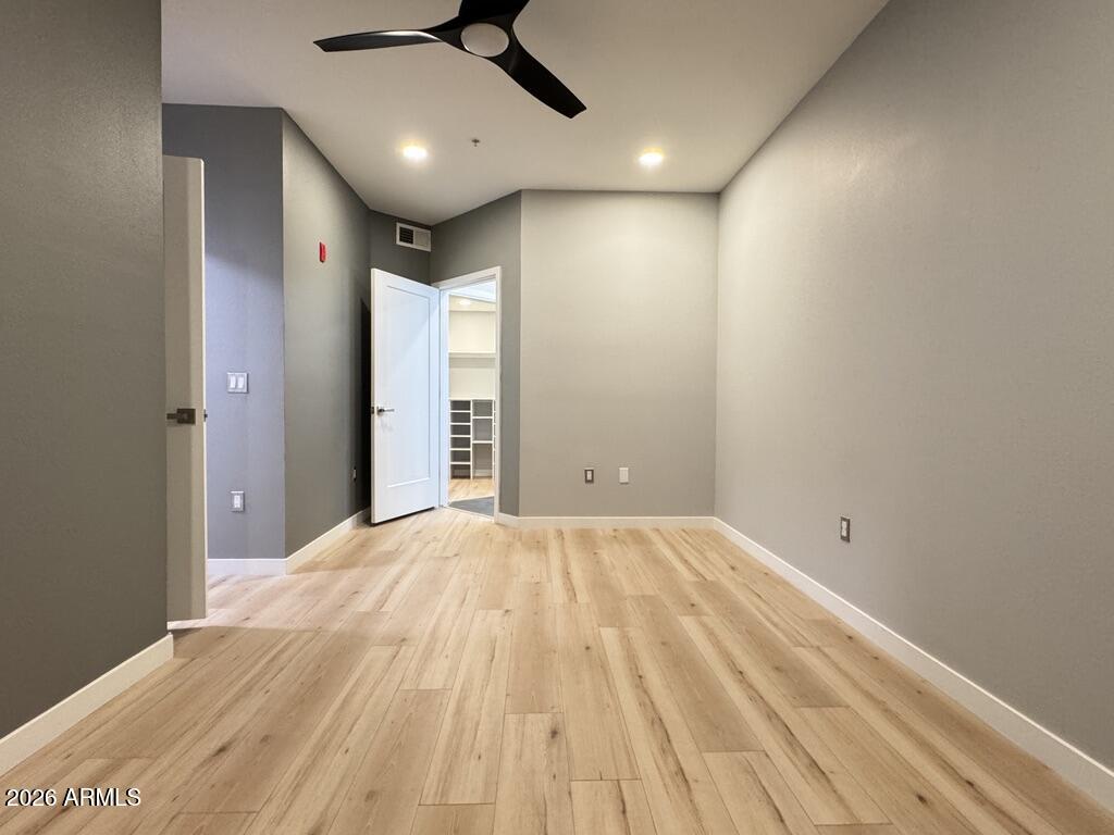 1701 East Colter Street, Unit 431 Phoenix, AZ 85016 - Photo 15 of 23 a view of empty room with wooden floor