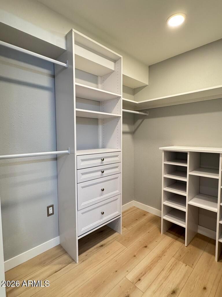 1701 East Colter Street, Unit 431 Phoenix, AZ 85016 - Photo 17 of 23 a view of walk in closet with empty racks