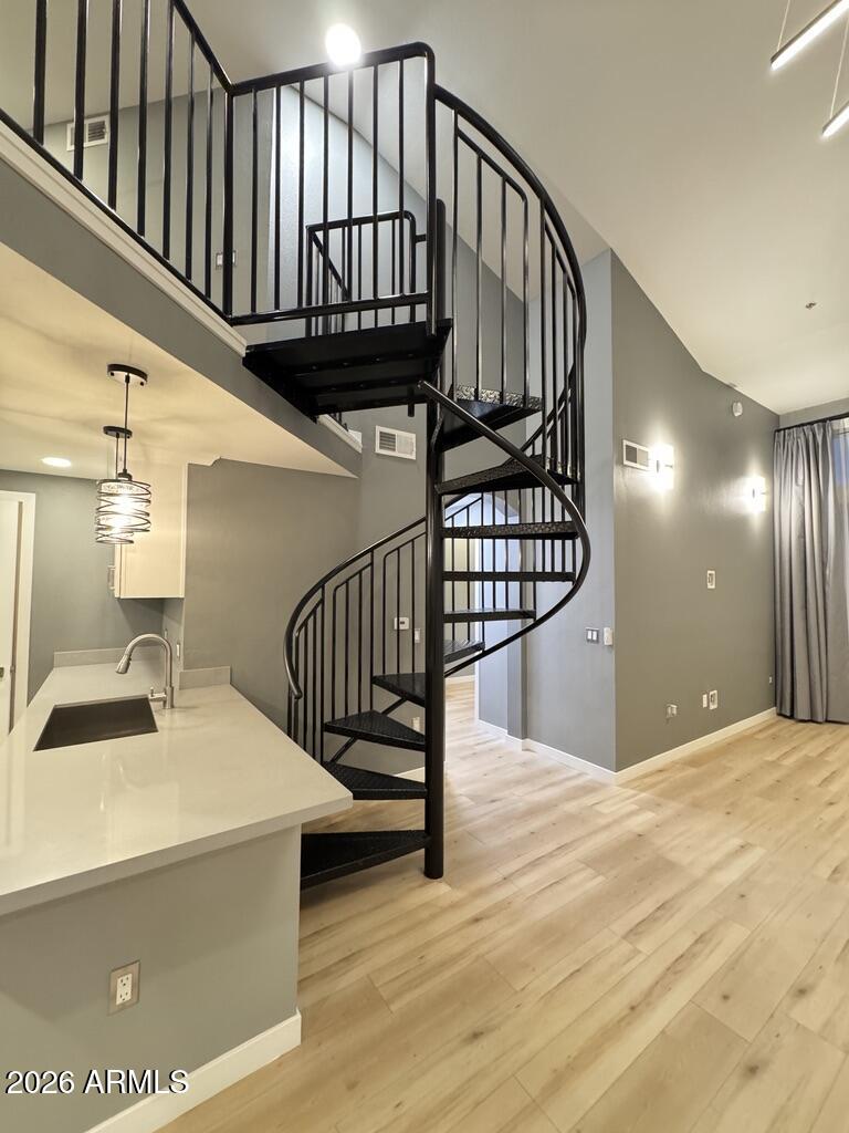 1701 East Colter Street, Unit 431 Phoenix, AZ 85016 - Photo 8 of 23 a view of entryway and hall with wooden floor