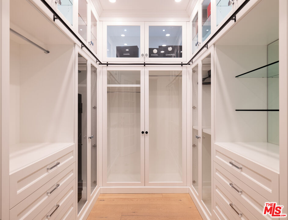 17204 Rancho Street Encino, CA 91316 - Photo 13 of 30 a view of walk in closet with empty racks