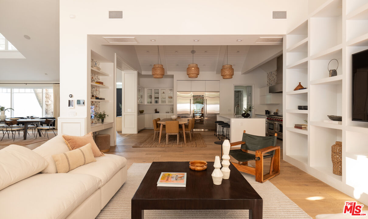 17204 Rancho Street Encino, CA 91316 - Photo 20 of 30 a living room with furniture and a large window