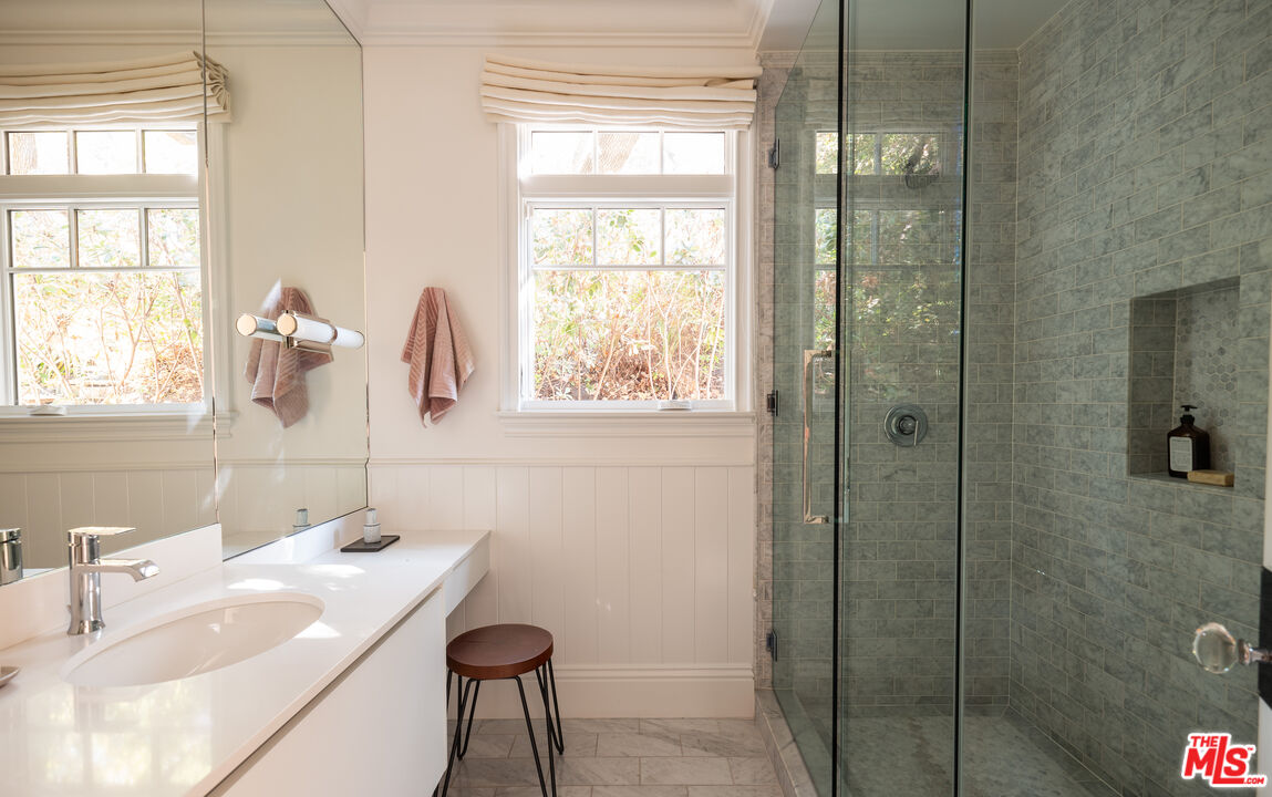 17204 Rancho Street Encino, CA 91316 - Photo 23 of 30 a bathroom with a sink and a mirror