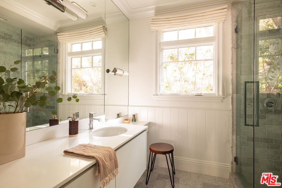 17204 Rancho Street Encino, CA 91316 - Photo 25 of 30 a bathroom with a sink a toilet and shower