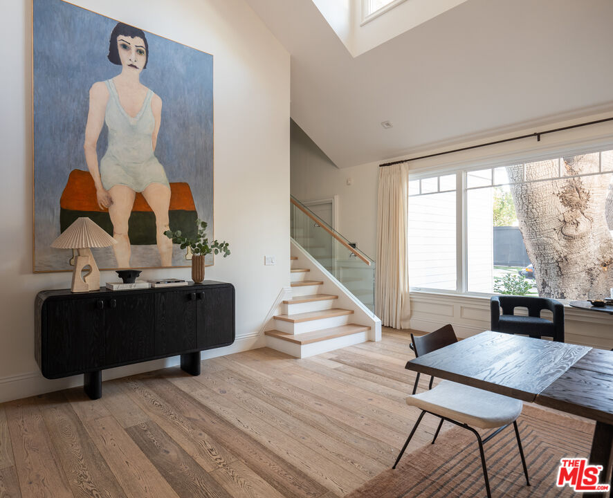 17204 Rancho Street Encino, CA 91316 - Photo 26 of 30 a living room with furniture and wooden floor