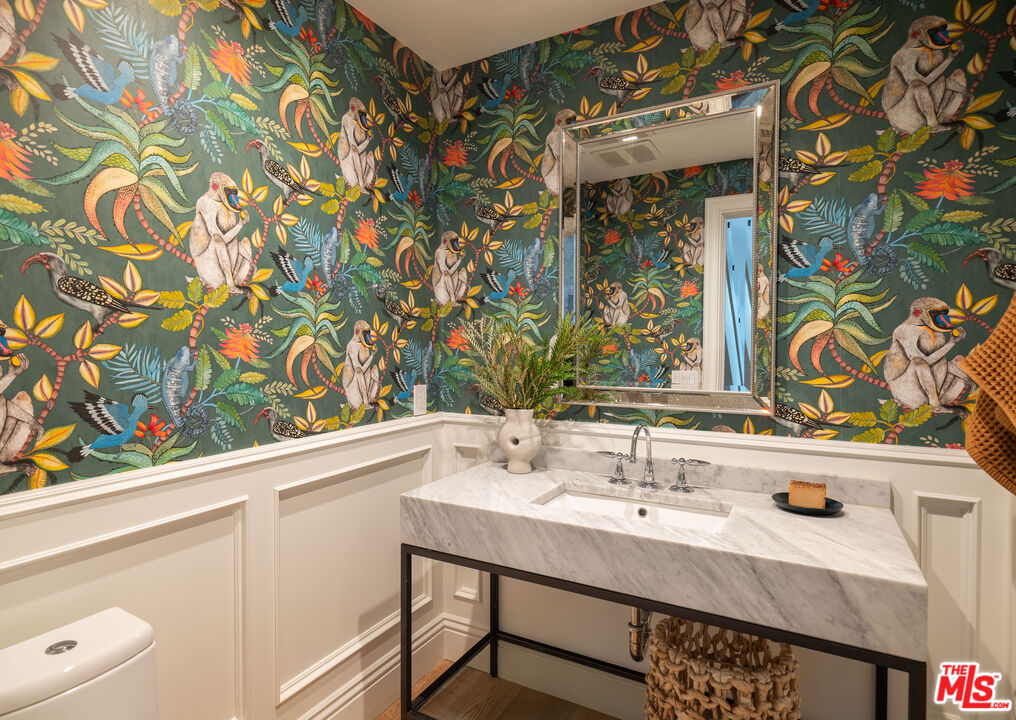 17204 Rancho Street Encino, CA 91316 - Photo 29 of 30 a bathroom with a sink and a mirror