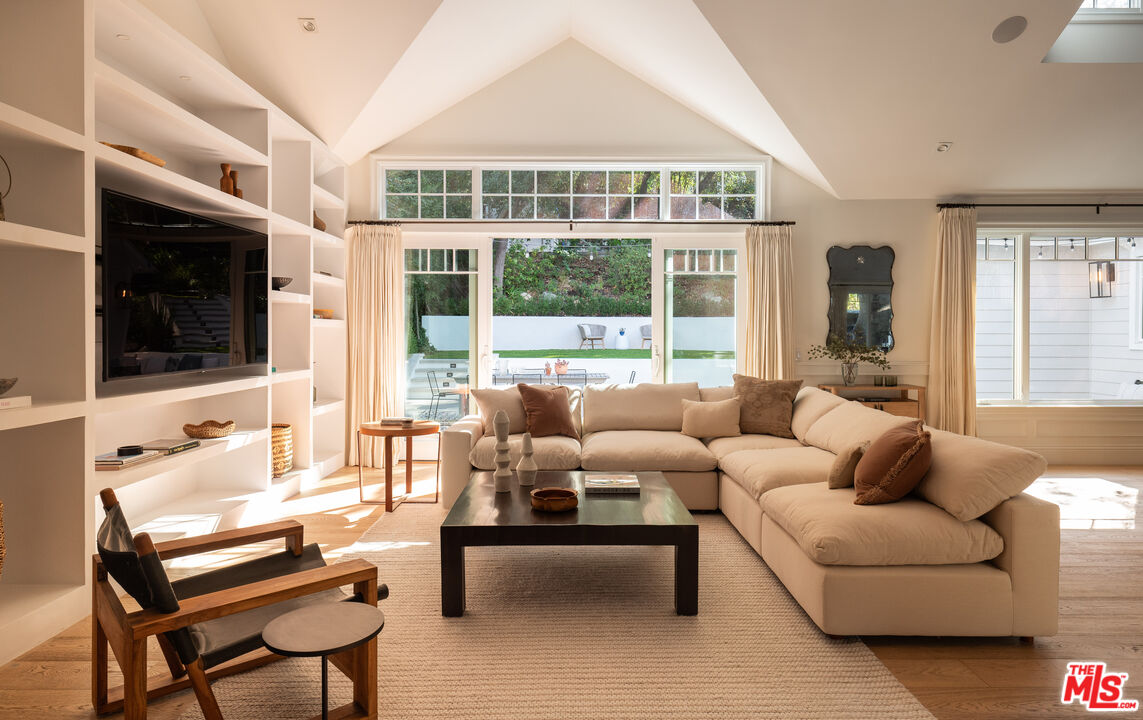 17204 Rancho Street Encino, CA 91316 - Photo 5 of 30 a living room with furniture and a flat screen tv