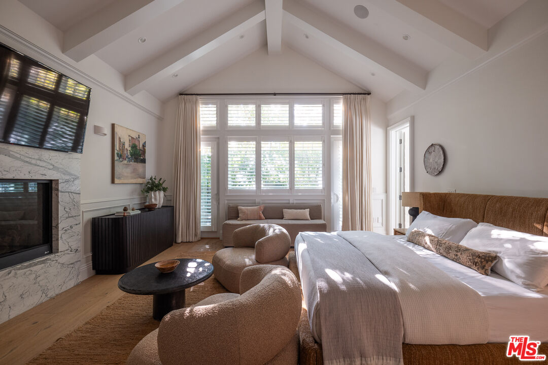 17204 Rancho Street Encino, CA 91316 - Photo 8 of 30 a bedroom with two beds and a fireplace