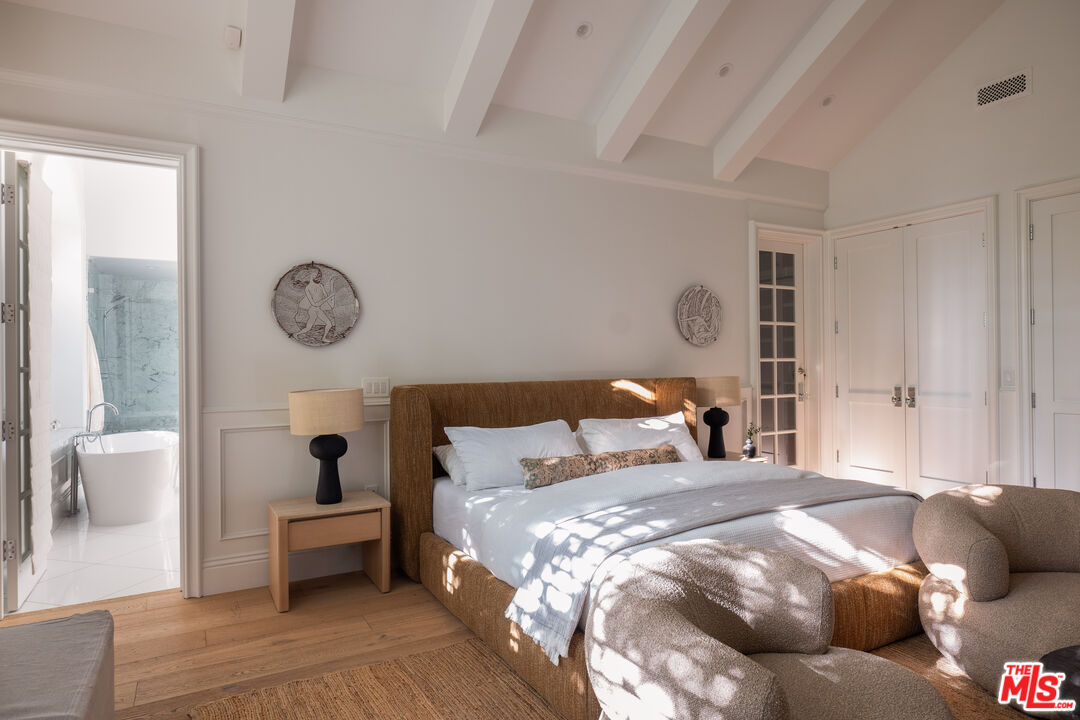 17204 Rancho Street Encino, CA 91316 - Photo 9 of 30 a bedroom with a bed and a couch