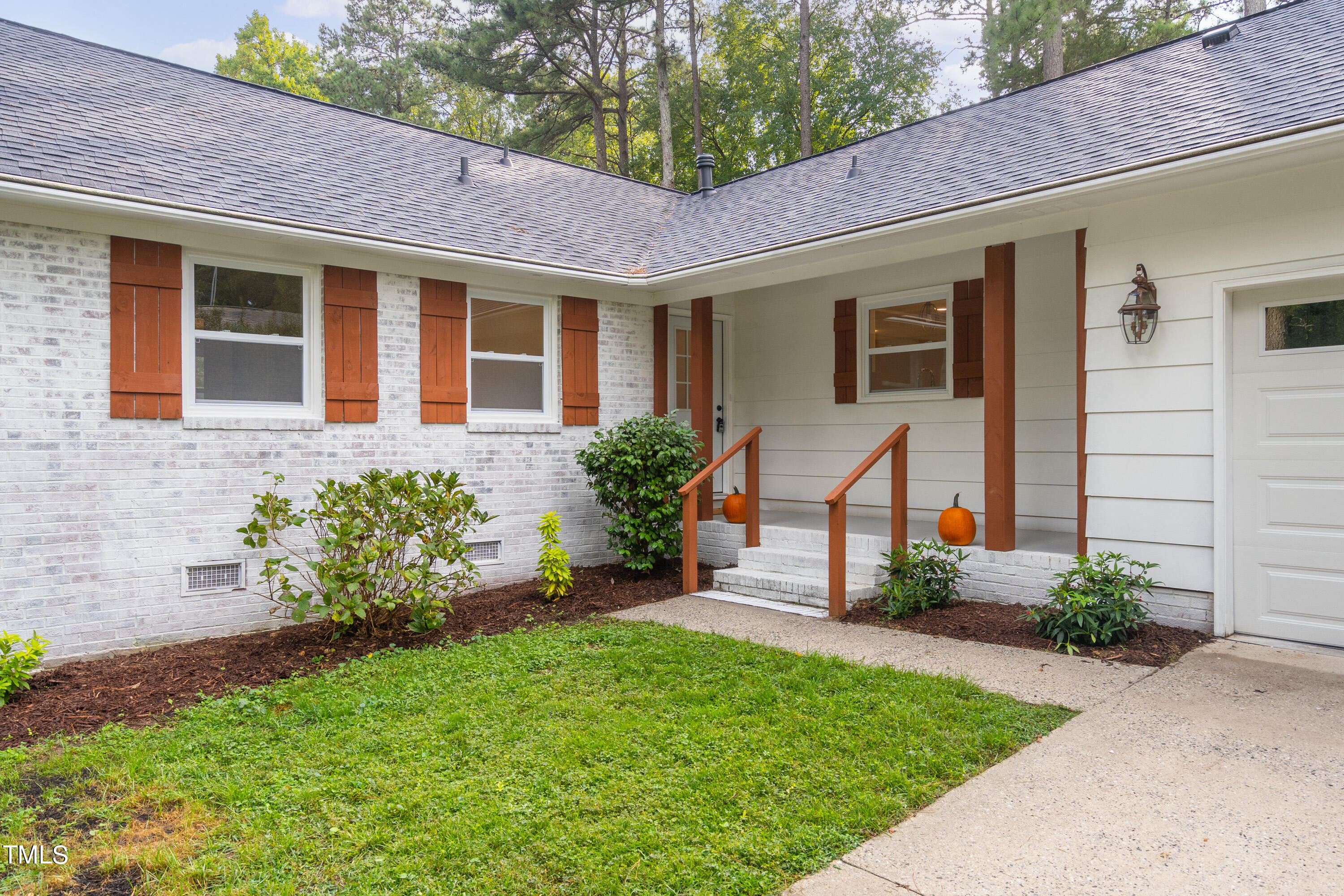 4817 Latimer Road Raleigh, NC 27609 - Photo 42 of 45 a front view of a house with a yard and outdoor seating