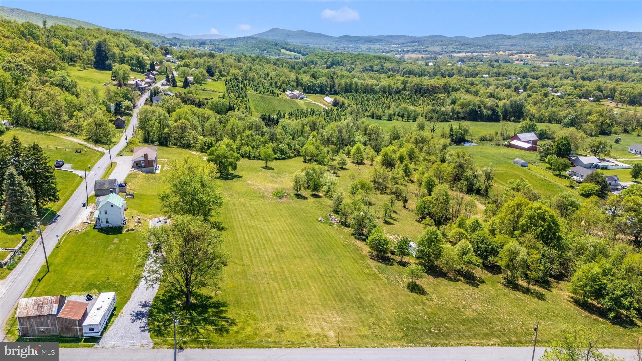 56 Clevelandtown-netz Road Boonsboro, MD 21713 - Photo 18 of 20 a view of a lush green forest with a lake