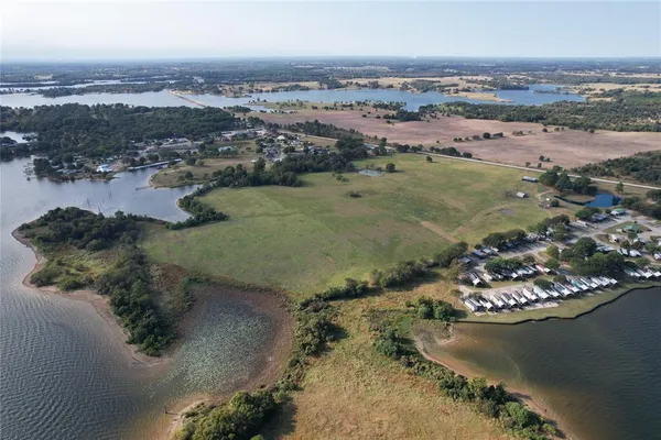 an aerial view of a house with a lake view