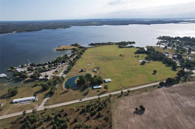 an aerial view of a residential building with outdoor space