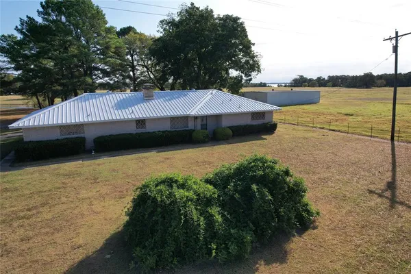 a view of a lake with a yard