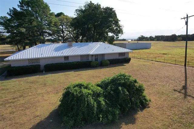 a view of a lake with a yard