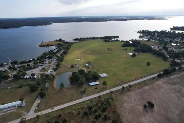 an aerial view of a residential houses with outdoor space
