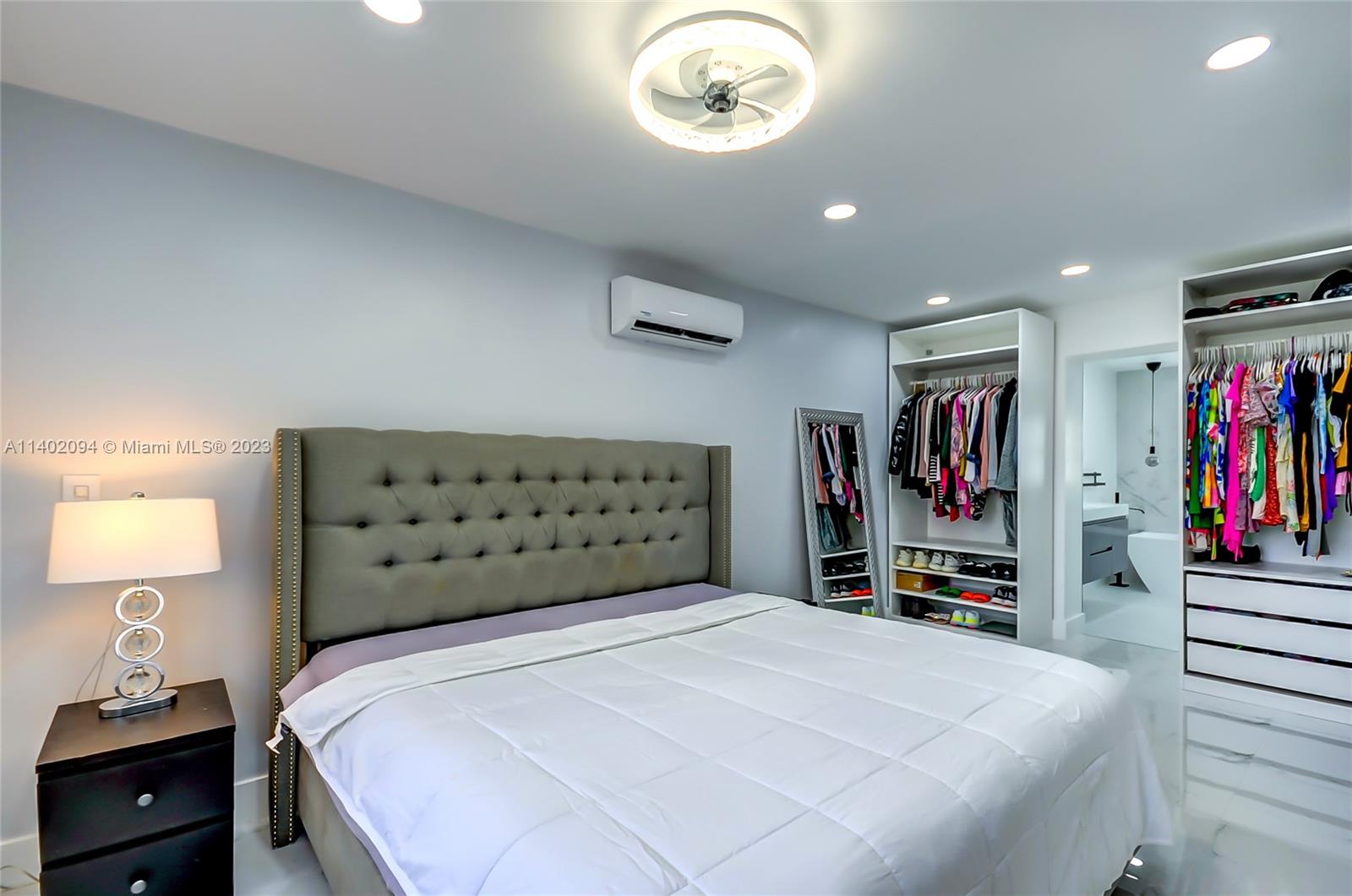 4260 Southwest 99th Avenue Miami, FL 33165 - Photo 13 of 36 a bedroom with a bed and a book shelf