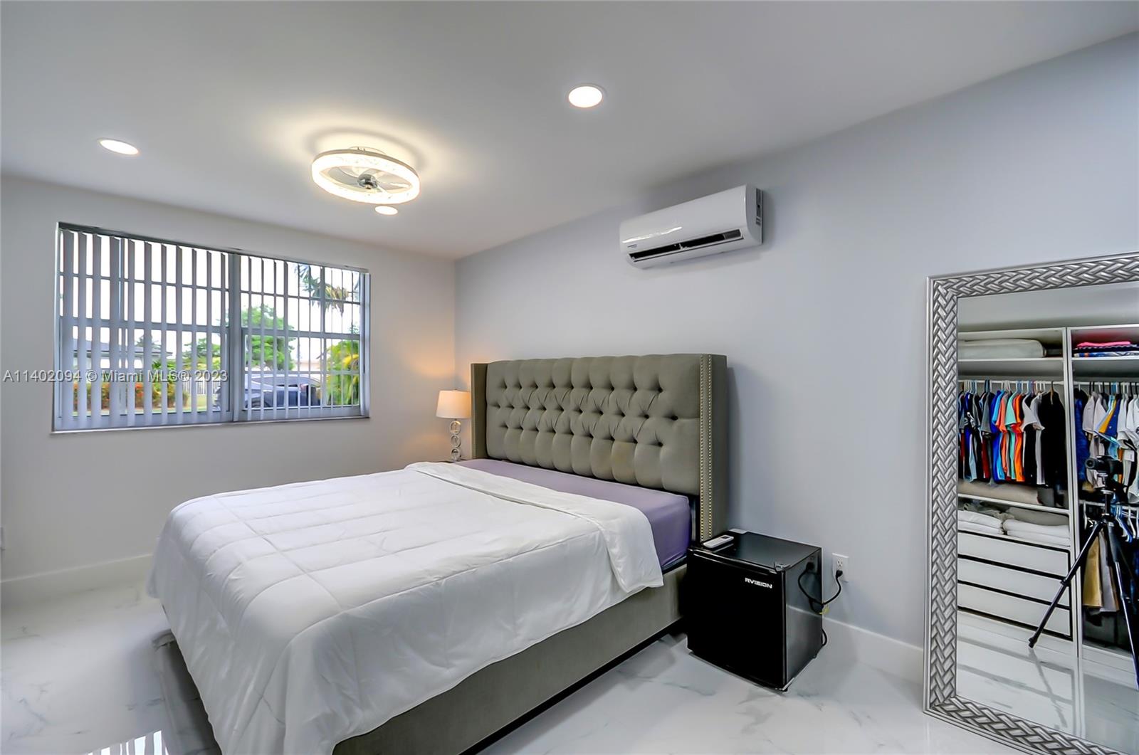 4260 Southwest 99th Avenue Miami, FL 33165 - Photo 14 of 36 a bedroom with a bed and a large window