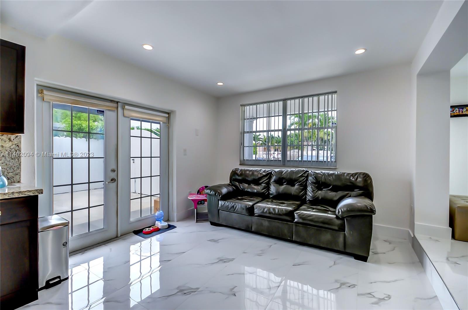 4260 Southwest 99th Avenue Miami, FL 33165 - Photo 2 of 36 a living room with furniture and a window