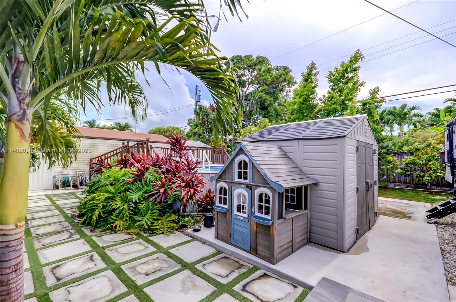 4260 Southwest 99th Avenue Miami, FL 33165 - Photo 23 of 36 a aerial view of a house with a yard and potted plants