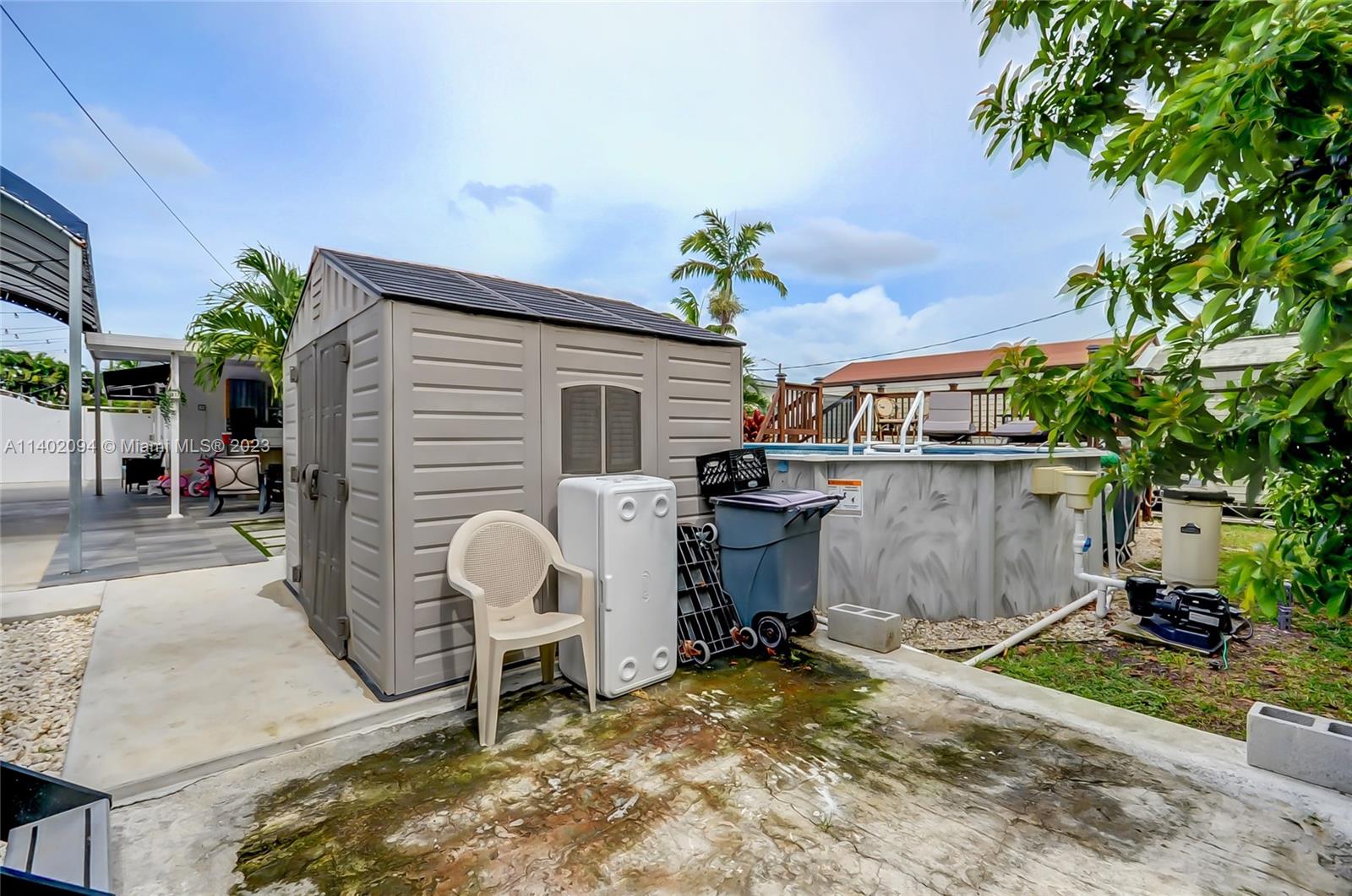 4260 Southwest 99th Avenue Miami, FL 33165 - Photo 30 of 36 a view of backyard with plants and outdoor seating