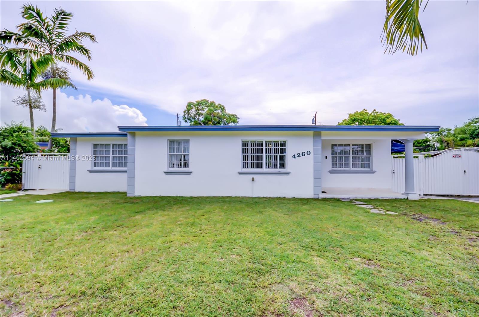 4260 Southwest 99th Avenue Miami, FL 33165 - Photo 33 of 36 a front view of a house with garden