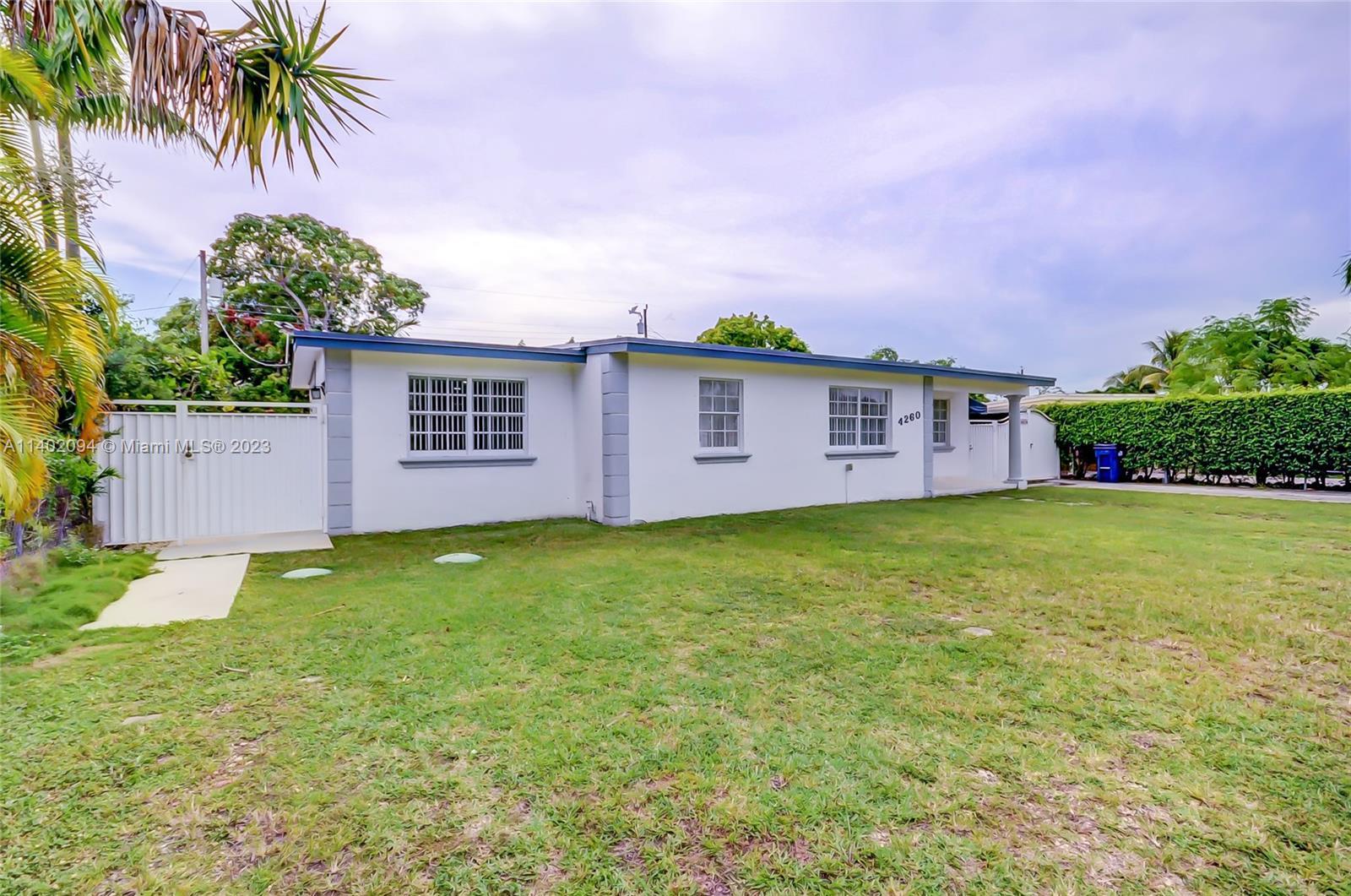 4260 Southwest 99th Avenue Miami, FL 33165 - Photo 34 of 36 a view of a house with a garden