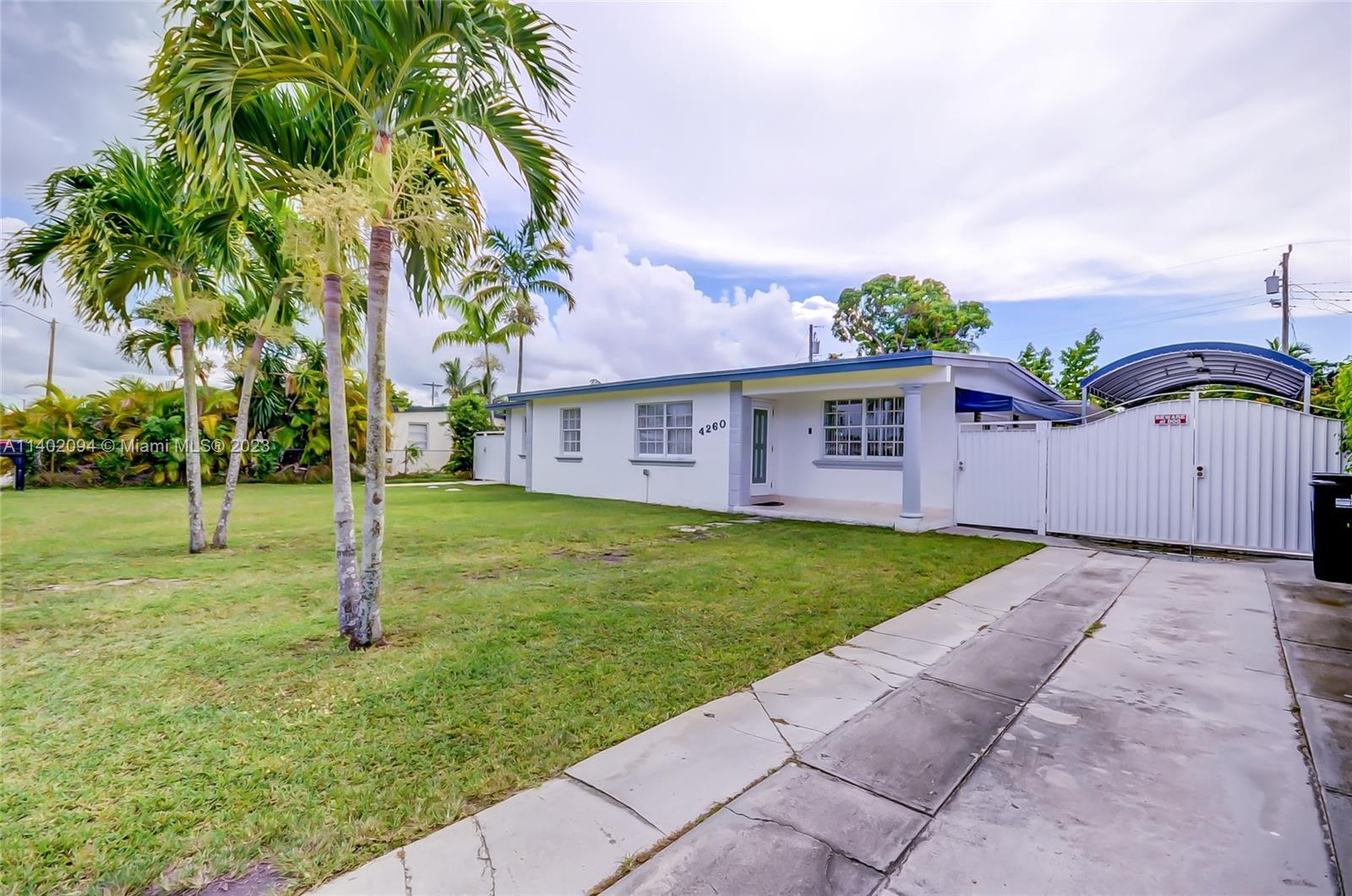 4260 Southwest 99th Avenue Miami, FL 33165 - Photo 35 of 36 a view of a house with a yard