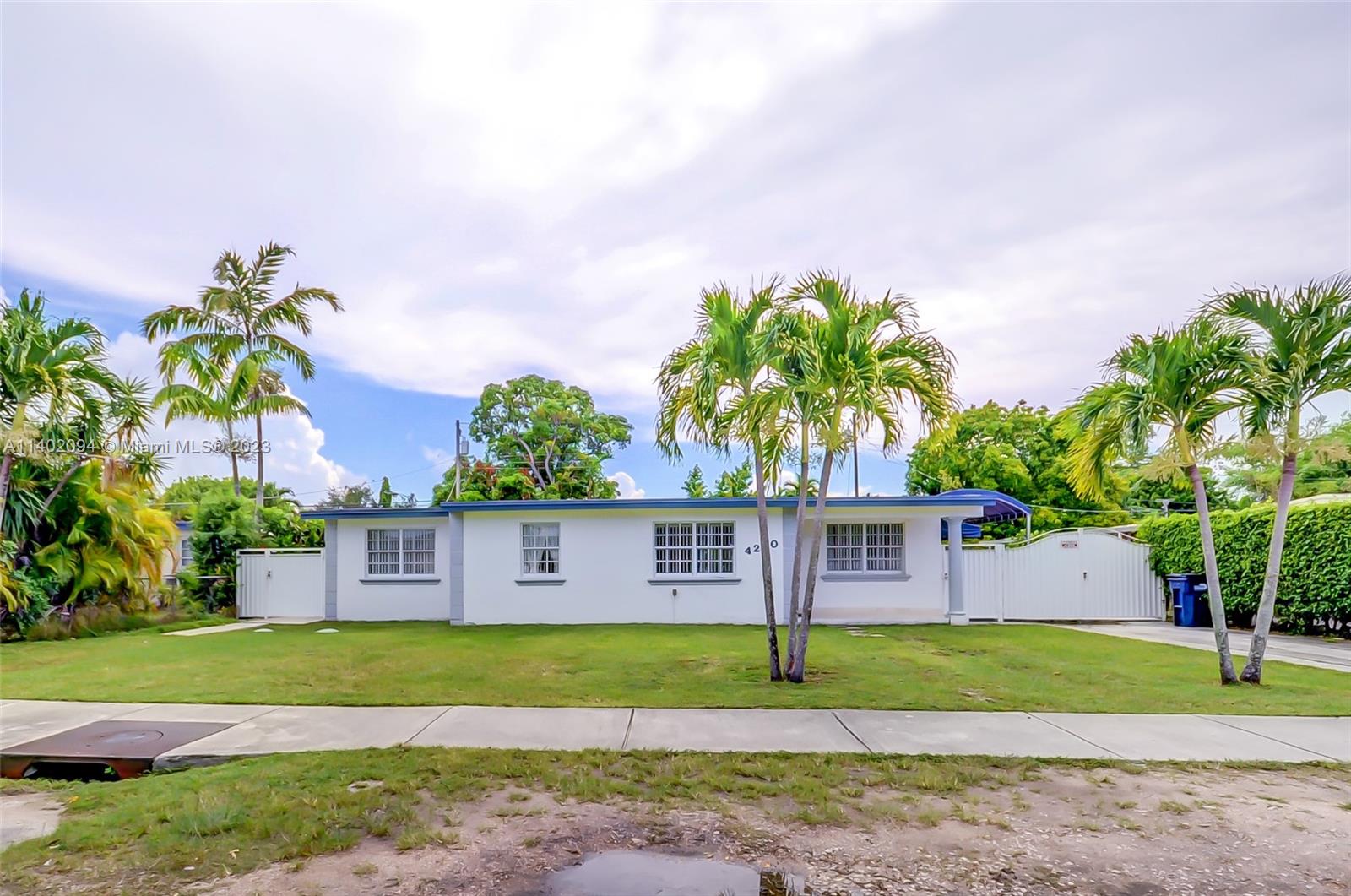 4260 Southwest 99th Avenue Miami, FL 33165 - Photo 36 of 36 a view of a house with a yard and a large tree center