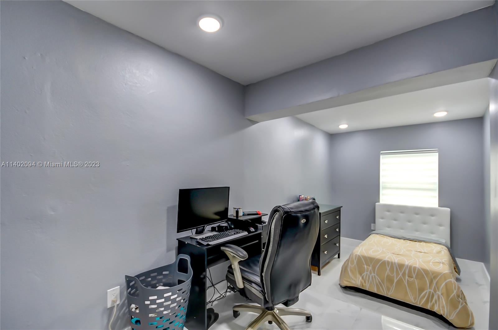 4260 Southwest 99th Avenue Miami, FL 33165 - Photo 6 of 36 a view of a workspace with furniture and a window
