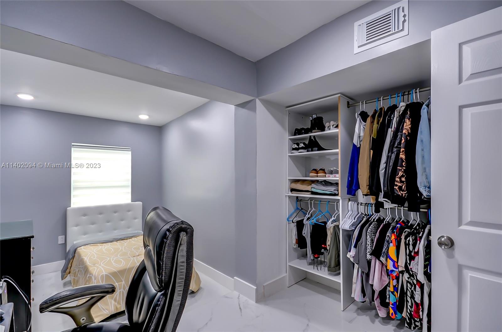 4260 Southwest 99th Avenue Miami, FL 33165 - Photo 7 of 36 a view of a walk in closet with clothes