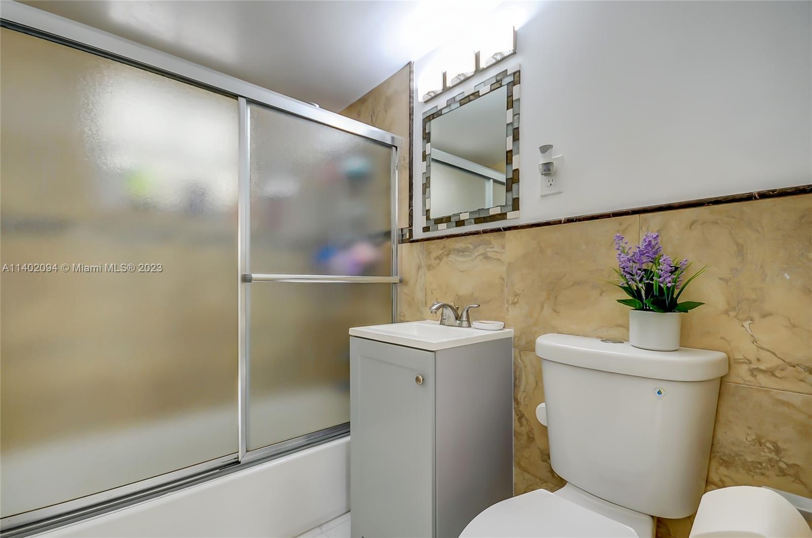 4260 Southwest 99th Avenue Miami, FL 33165 - Photo 10 of 36 a bathroom with a toilet sink and shower