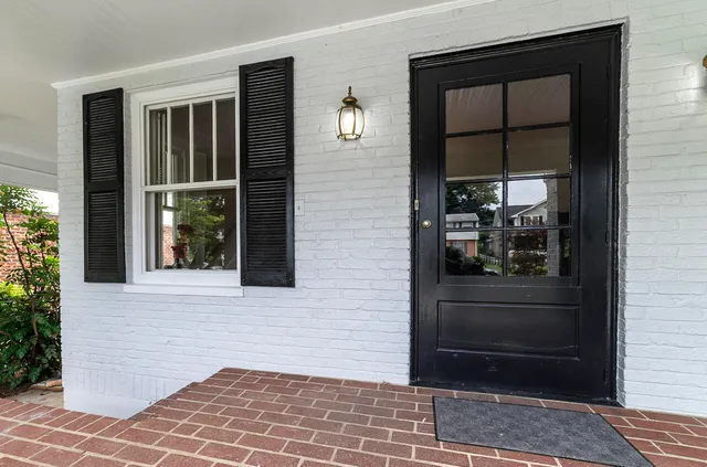 a view of entrance door of the house and a window