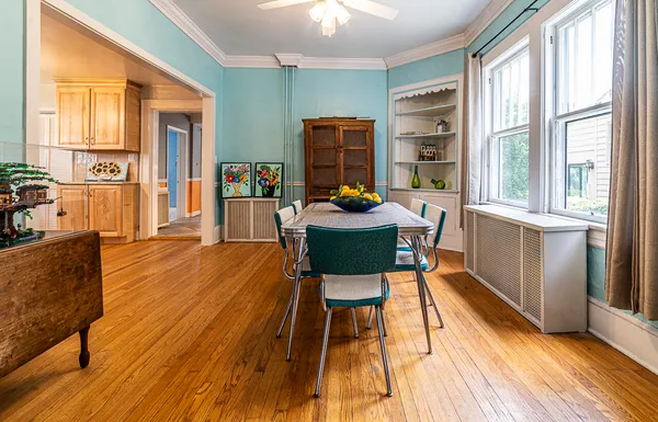 a view of a dining room with furniture window and wooden floor