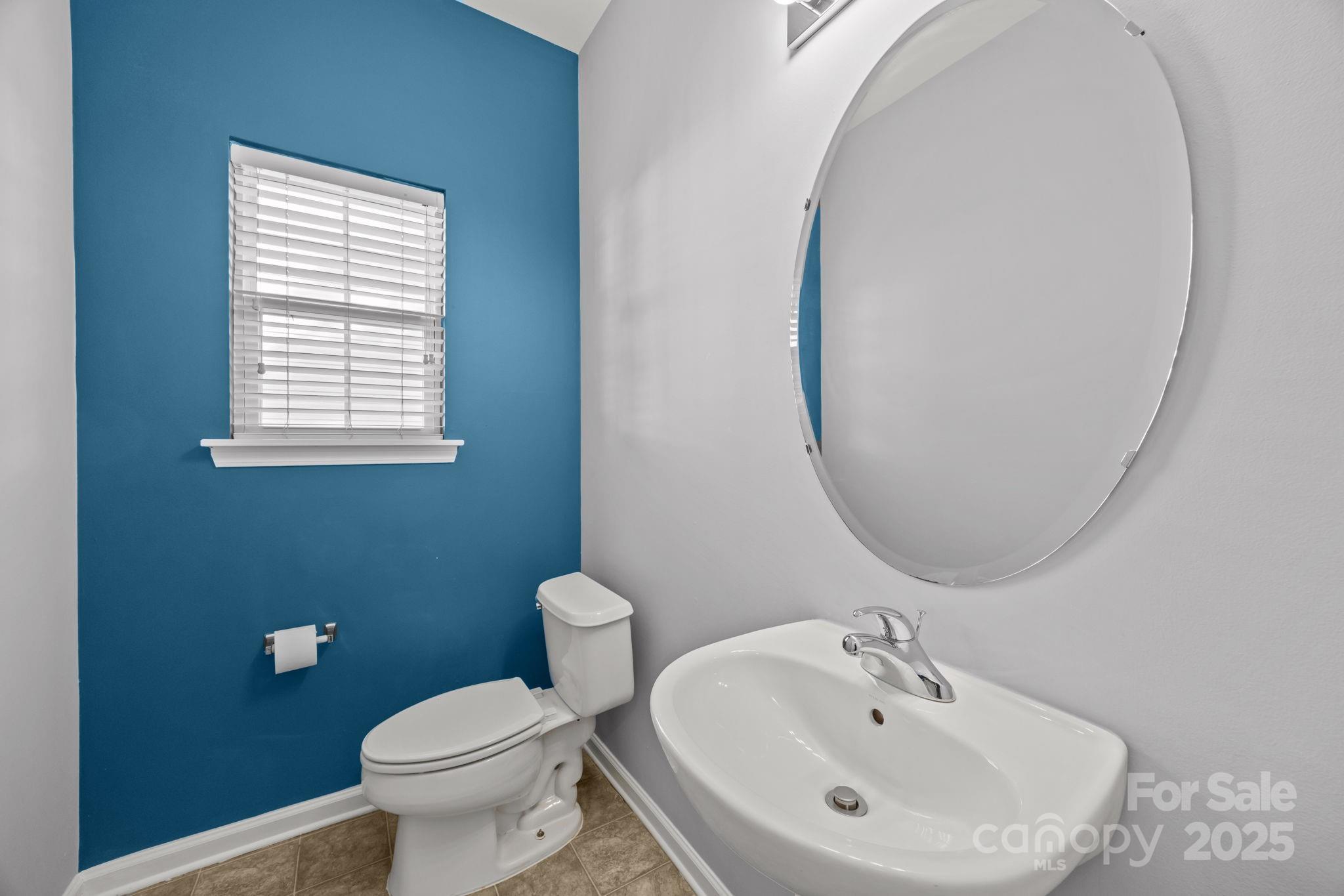 218 Tail Race Lane Fort Mill, SC 29715 - Photo 14 of 42 a bathroom with a sink a mirror and a toilet