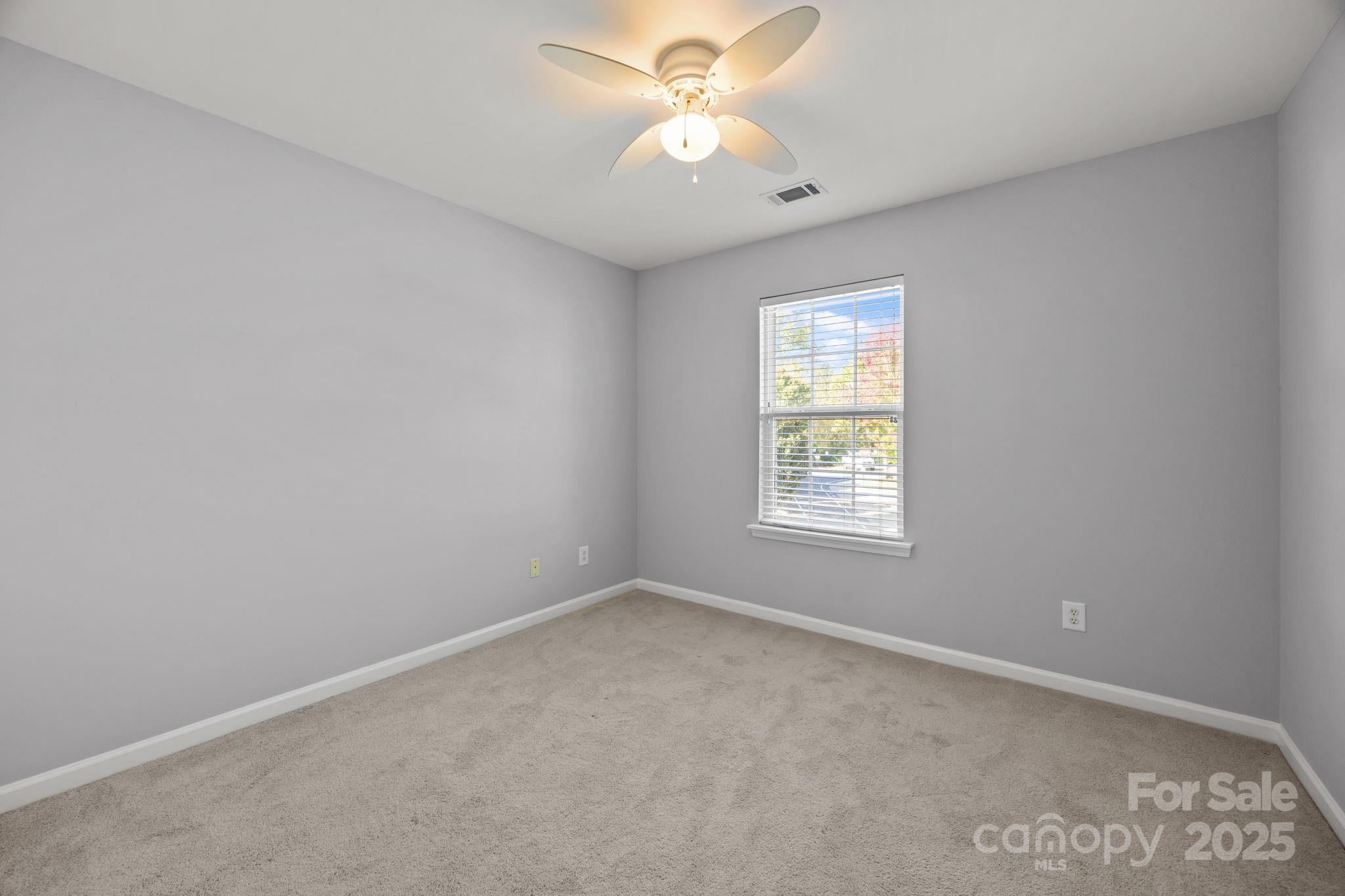 218 Tail Race Lane Fort Mill, SC 29715 - Photo 20 of 42 an empty room with windows and fan