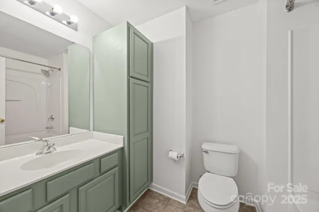 a view of a room that has a grey walls