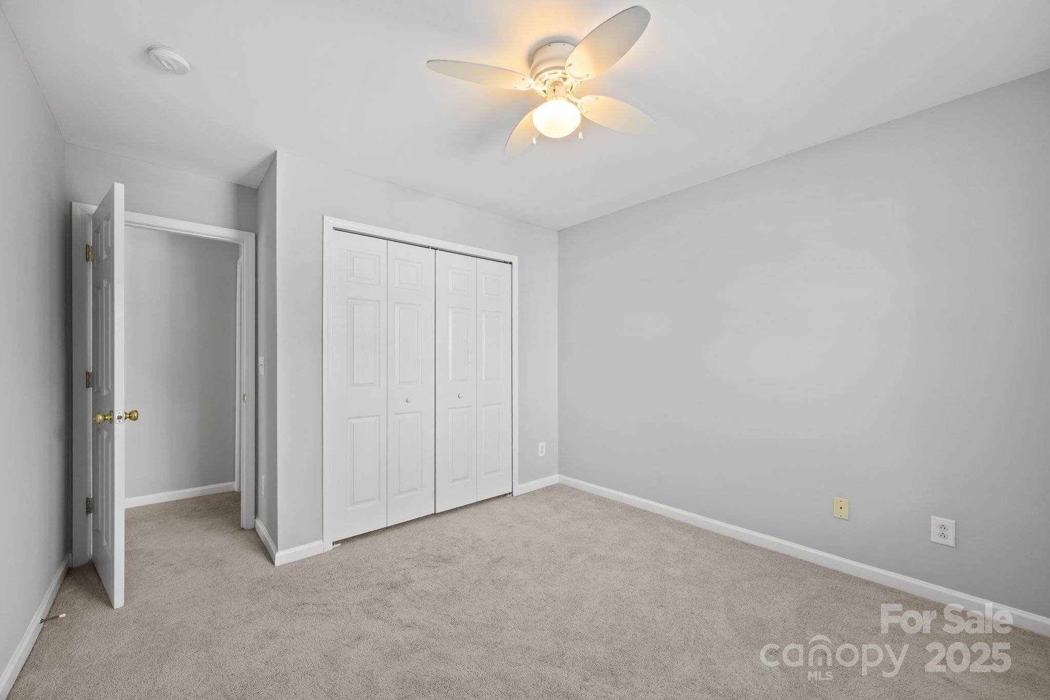218 Tail Race Lane Fort Mill, SC 29715 - Photo 25 of 42 a view of a room with a ceiling fan and a fan